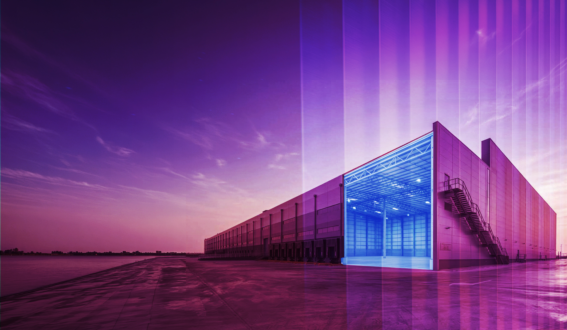 Large warehouse with an open, lit loading bay